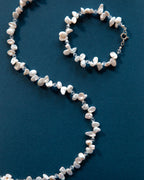 Pulseira de pérolas e cristais